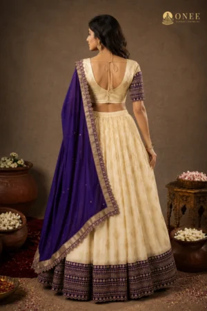 ONEE ivory bridal lehenga with royal blue dupatta and gold butti work