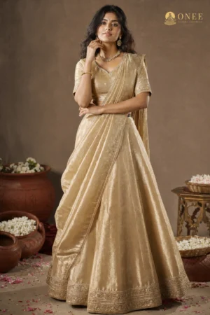 ONEE gold tissue silk bridal lehenga with matching dupatta and embroidered hem